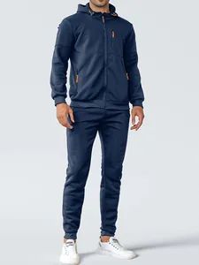 Full view of a men's navy blue hooded tracksuit set with orange zipper accents.