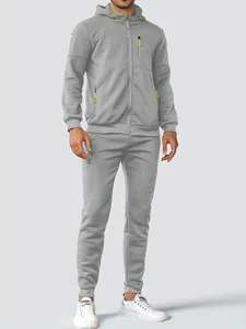 Full body detail of men's casual grey hooded tracksuit with bright lime green zipper accents