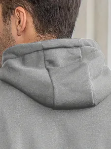 Detail shot of the back of a grey men's hooded sweatshirt showing fabric texture