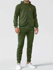 Close-up detail of a dark green men's tracksuit featuring a hooded zipper jacket and pants