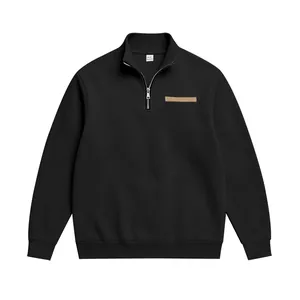 Sweat-shirt noir lourd pour homme avec demi-zip, doublure polaire et écusson en cuir