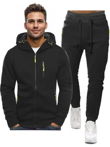 Men's black tracksuit set with hoodie and joggers featuring lime green zipper accents.