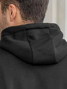 Detail view of black men's hoodie showing fabric texture and hood construction.