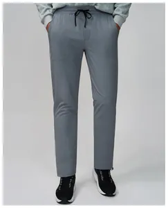 Detailed view of gray quick-dry breathable men's fitness pants for running and yoga