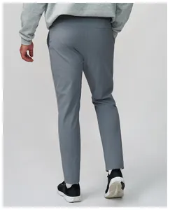 Rear view detail of grey quick-dry sports pants for men with breathable mesh fabric