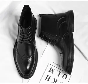 Detailed view of black men's leather brogue boots with intricate carved patterns.