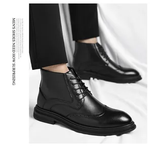 Detail of men's black brogue boots featuring intricate hole-punched leather design
