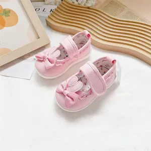 Adorable pink canvas walking shoes for toddler girls with bunny ears and bow detail