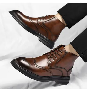 Detailed view of men's classic brown leather Brogue boots with wingtip carving details