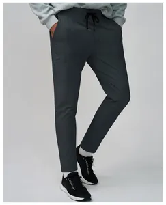 Macro detail view of charcoal grey quick-dry breathable tapered athletic pants for men