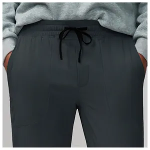Close-up of dark grey quick-dry breathable mesh athletic pants with drawstring waist