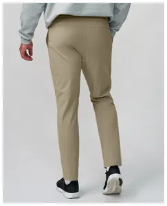 Back view of men's khaki quick-dry athletic pants showing breathable fabric texture