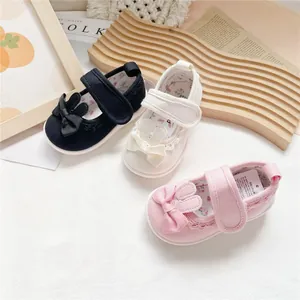 Adorable canvas walking shoes for baby girls featuring rabbit ears and decorative bows