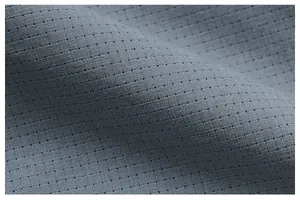 Close-up of breathable grey micro-pore fabric for quick-dry sports pants.