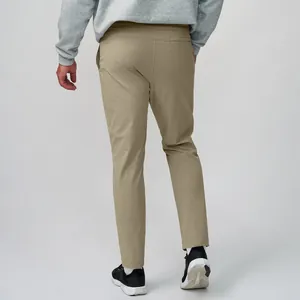 High-performance men's khaki quick-dry athletic pants for running and yoga, back view