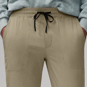 Men's khaki quick-dry joggers with breathable mesh texture and black drawstring waist