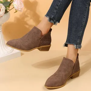 Chic brown V-cut ankle boots with laser-cut details and low stacked heel for women.