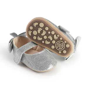 Glittery silver baby girl pre-walker shoes with non-slip sole and cute bow detail.