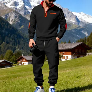 Conjunto de chándal cargo negro para hombre con detalles naranja en la montaña