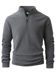 Close-up of men's grey polar fleece sweatshirt with half-zipper and stand collar