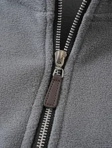 Macro view showing the sturdy metal zipper and texture of this gray fleece jacket