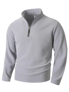 Close-up detail of men's grey polar fleece half-zip sweatshirt with stand collar