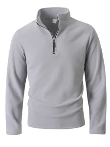 Close-up detail of a grey men's half-zip polar fleece sweatshirt with stand collar