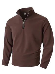 Close-up of men's brown fleece pullover featuring a stand collar and half-zip detail
