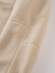 Close-up of soft thickened polar fleece fabric with neat stitching details.