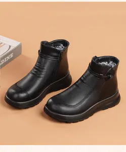 Detail view of black fleece-lined leather short boots for elderly women