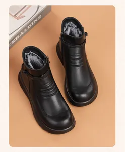 Warm black faux leather ankle boots with soft plush lining for elderly women's winter wear.