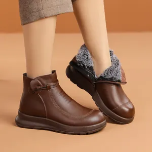 Warm fur-lined brown leather ankle boots for elderly women featuring a non-slip sole