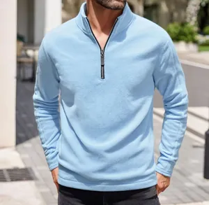 Close-up of a men's light blue thick polar fleece half-zip pullover sweatshirt