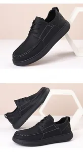Detail view of men's black business casual leather shoes with thick soles and stitching