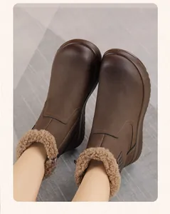Warm brown women's winter snow boots with soft faux fur lining and zipper detail
