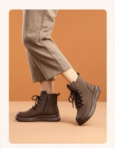 Side view of comfortable brown leather ankle boots with soft soles for winter