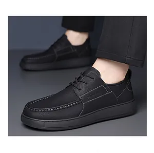 Professional close-up of men's black leather casual shoes with intricate white stitching.