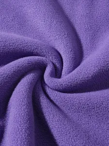 Macro detail shot showing the soft and warm texture of purple polar fleece material