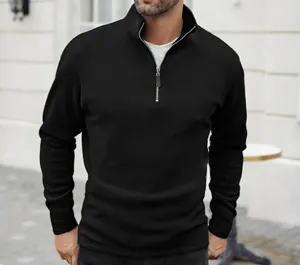Close-up of a men's black quarter-zip fleece pullover in a solid color design