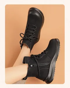 Side view of black leather winter ankle boots for women with side zipper and laces