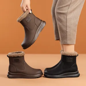 Warm women's winter snow boots with plush lining and thick sole in brown and black