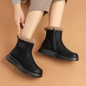 Chic black women's winter snow boots featuring warm faux fur lining and convenient side zipper