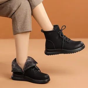 Black women's winter ankle boots with warm fur lining and non-slip soft rubber soles.