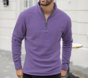 Detail view of purple polar fleece sweatshirt with stand collar and half-zipper design