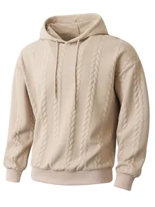Detail view of a men's beige hoodie featuring a cable-knit textured fabric and adjustable hood.