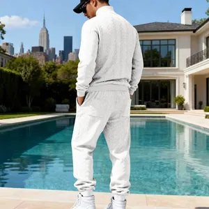 Back view of a heavy white jacquard tracksuit for men featuring high neck and joggers