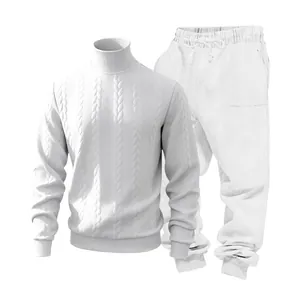 Detail view of heavy white cable knit turtleneck sweater and matching joggers