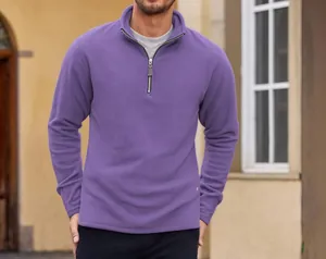 Detailed view of a men's purple quarter-zip fleece pullover showing texture and fit