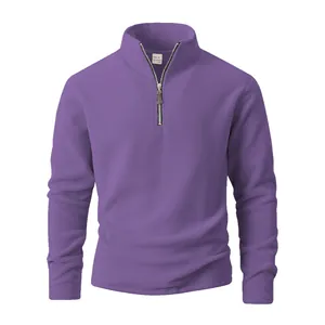 Detail view of men's purple polar fleece sweatshirt with half-zip stand collar