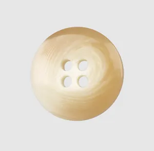 Macro detail of a high-end cream resin button with four holes and swirl texture.